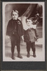 Two young boys standing next to each other